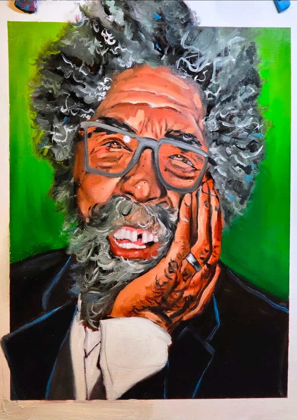Portrait of an older man with a grey beard against green